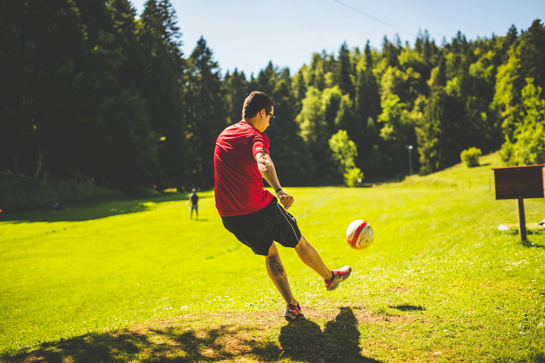 Soccer player practicing how to kich a ball
