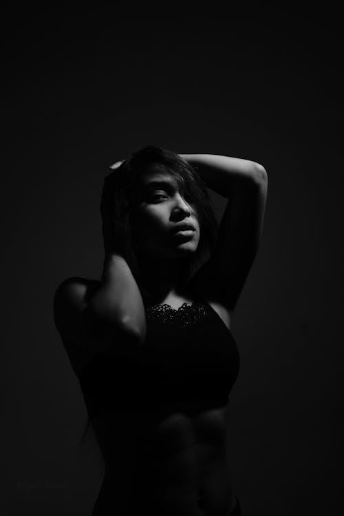 Grayscale Photo of a Sexy Woman in Black Tube Top