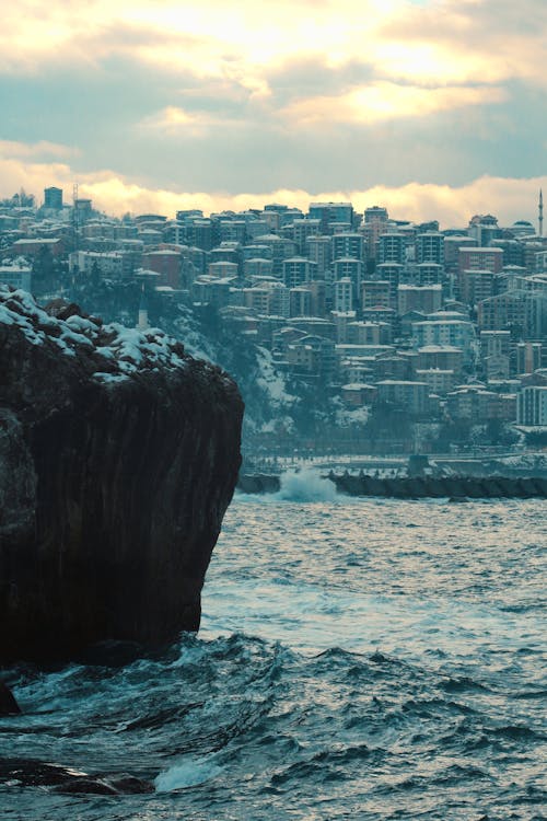 Rough Sea, Rock in Snow, and Waterfront with Blocks of Flats