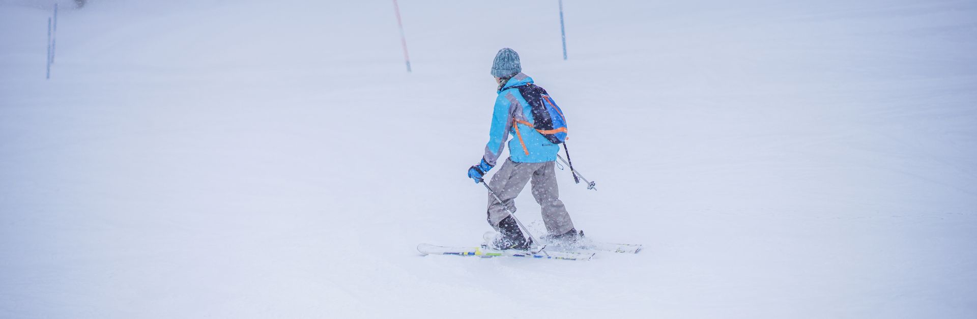 A skier enjoying a winter day on the snowy slopes of Gulmarg, creating a thrilling adventure in the