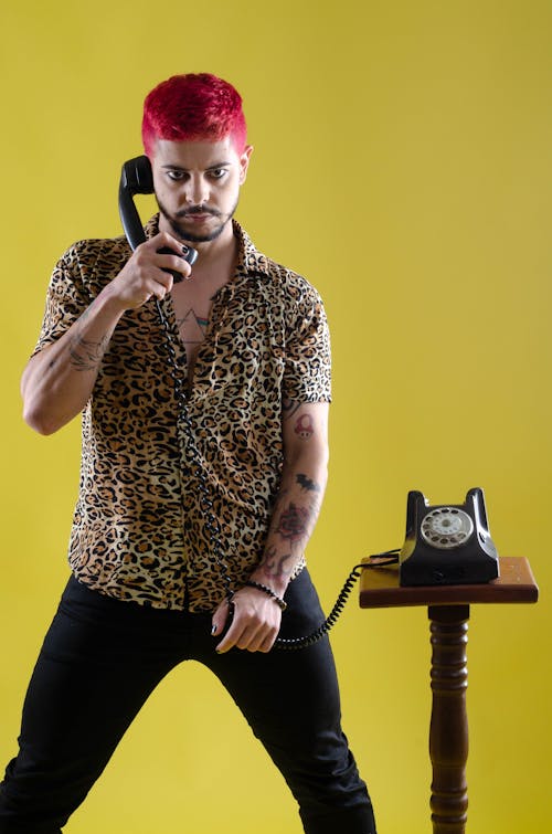 A Man Holding a Telephone