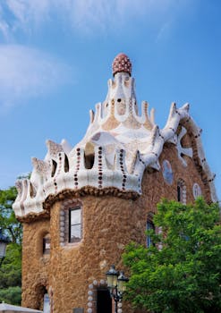 Unique Gaudí architectural design in Park Güell, Barcelona, showcasing vibrant organic shapes.