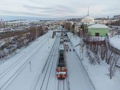 People Near a Train on Snow Covered Railway