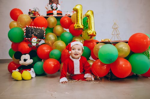 Baby Wearing a Santa Costume