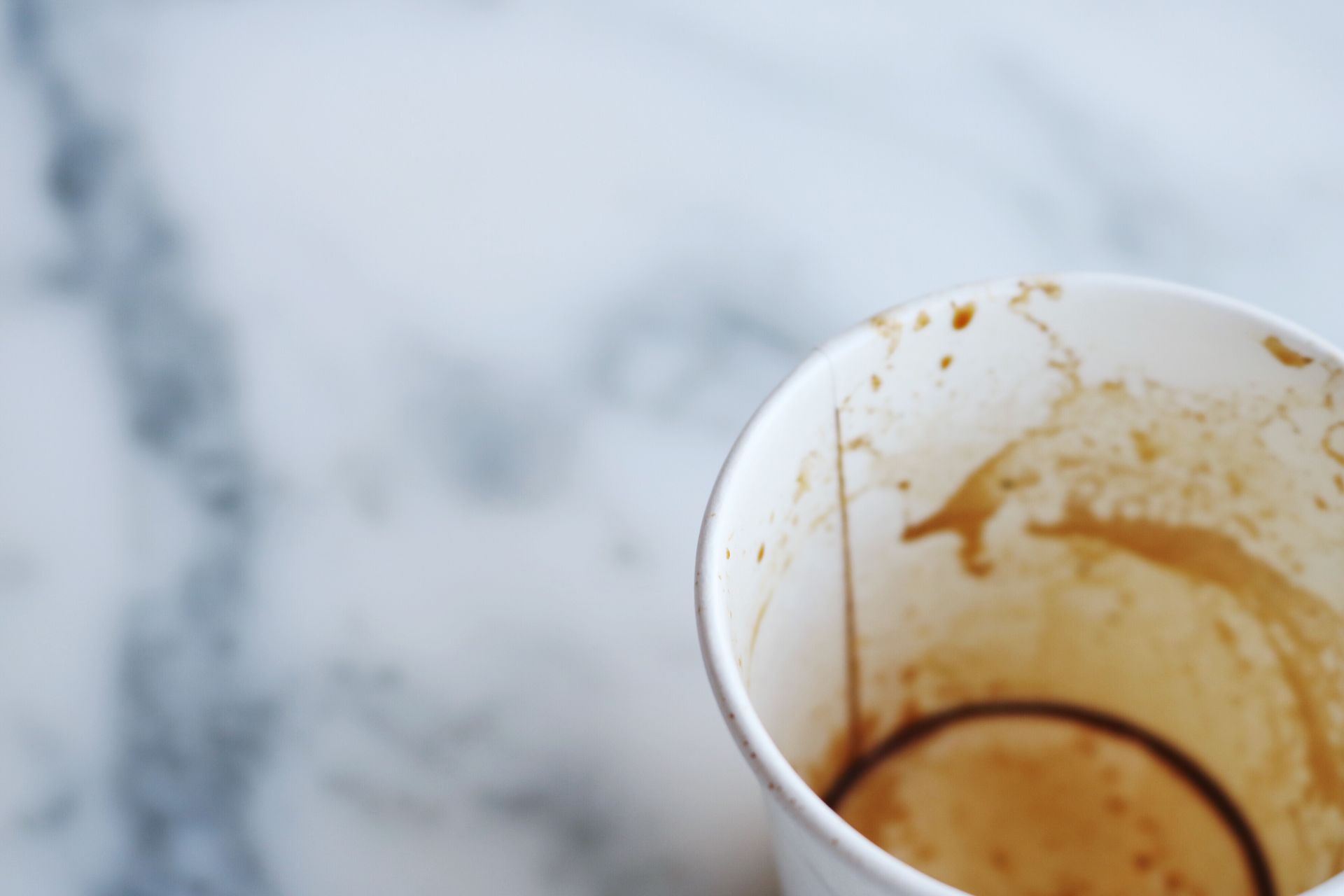 Tilt Shift Lens Photography of White Disposable Cup