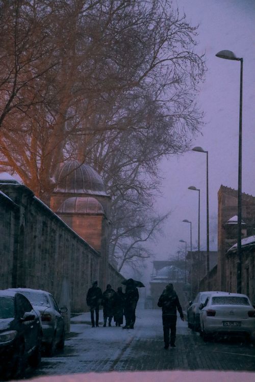 Free A snowy evening capturing people walking on a street in Istanbul. Stock Photo