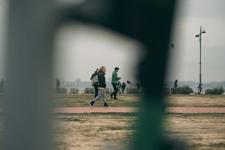 Side View Of A Woman With Backpack While Walking 