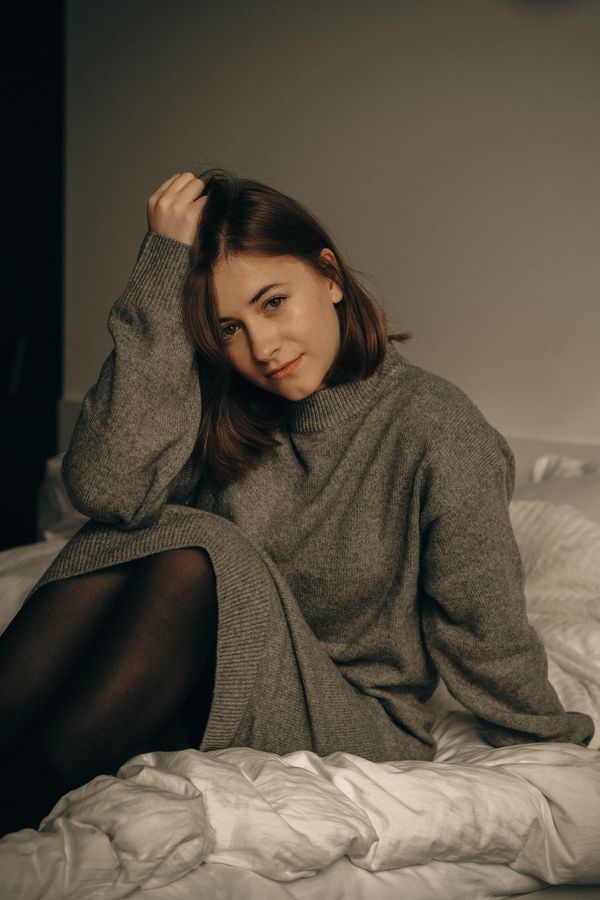 woman in charcoal mock-neck sweater dress