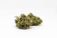 Green Kush on White Surface