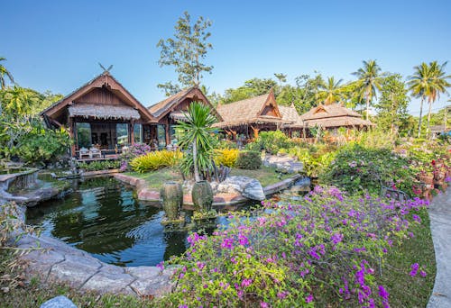 Brown Wooden House Near Body of Water