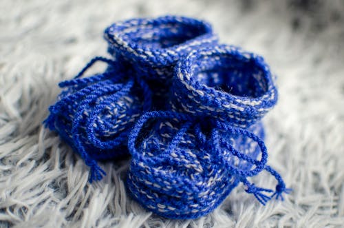 Free Blue Yarn on White Textile Stock Photo