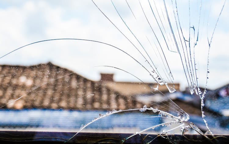 Close-up On Cracked Glass In Window