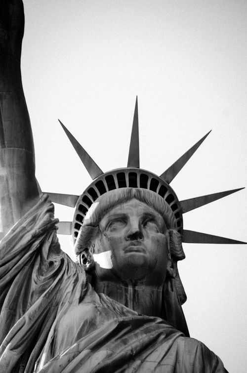 Free Detailed close-up of the Statue of Liberty in grayscale, showcasing its iconic features. Stock Photo