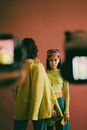 Man and Woman in Front of Cameras