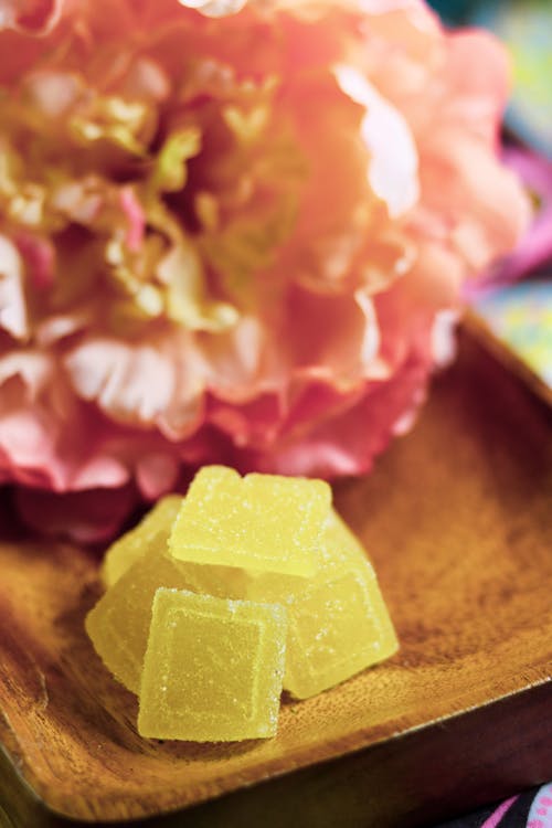 A Gummies on a Wooden Plate