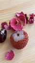 A Lychee on a Wooden Surface