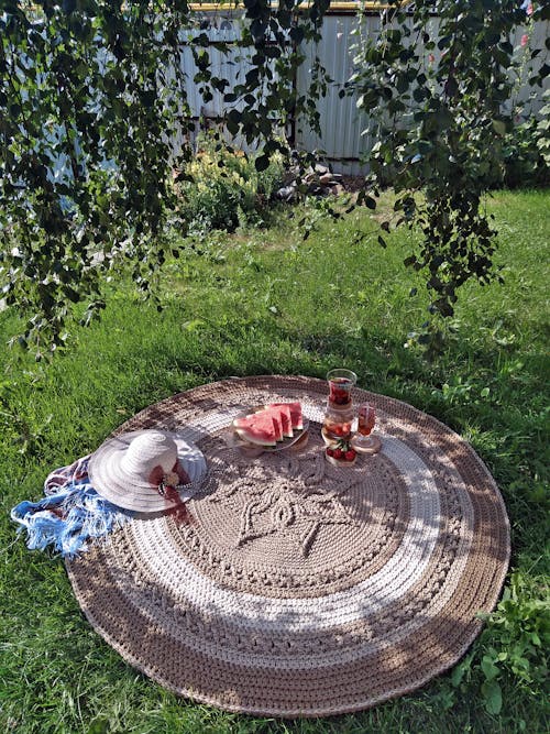 Brown Round Table on Green Grass Field