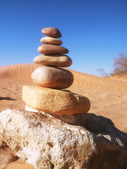 Stack of Stones on Brown Sand