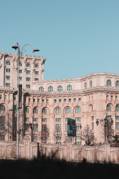 Free Daytime view of Bucharest's iconic Palace of the Parliament with its grand architecture. Stock Photo