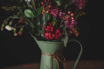 Rustic arrangement with red berries by Orcun Cikmaz on Pexels