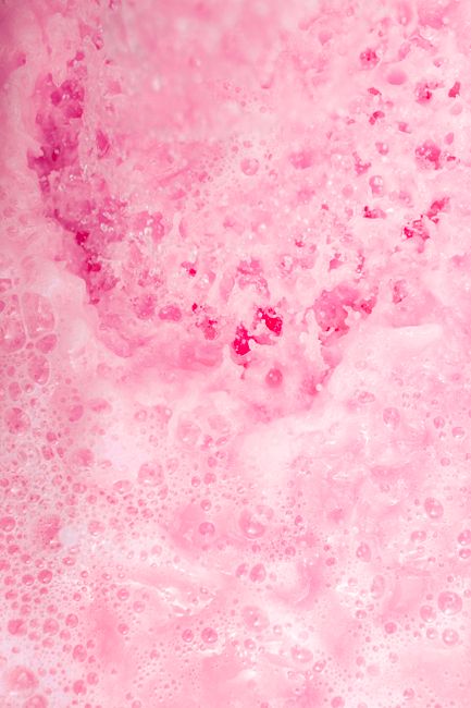 A captivating close-up of vibrant pink foam bubbles, creating an intriguing aesthetic texture.