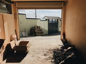 Brown Cardboard Boxes on White Sand