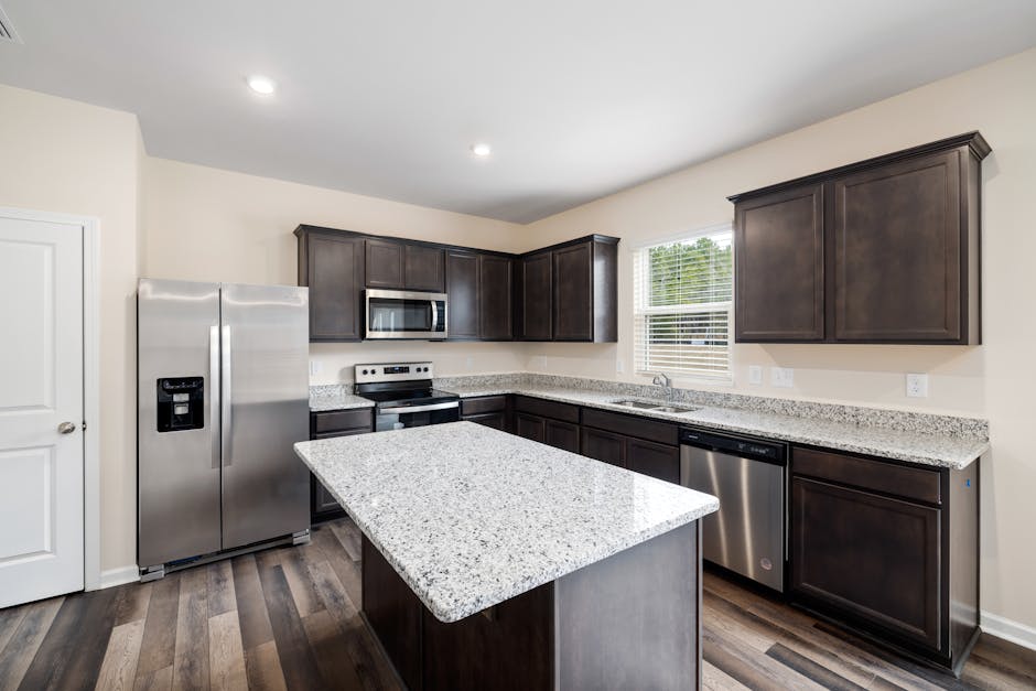 Modern mobile home interior with a kitchen featuring granite countertops and stainless steel appliances - should i buy a brand new mobile home Modern mobile home interior with a kitchen featuring granite countertops and stainless steel appliances - should i buy a brand new mobile home