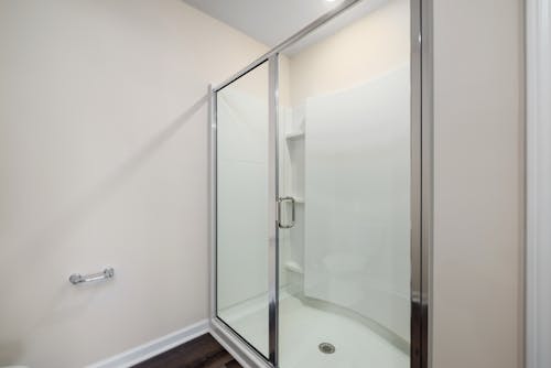 Clean Spacious Shower Room with Sliding Door