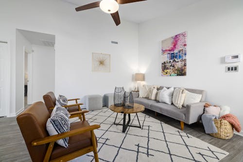 Brown Armchairs with Throw Pillows on the Sofa