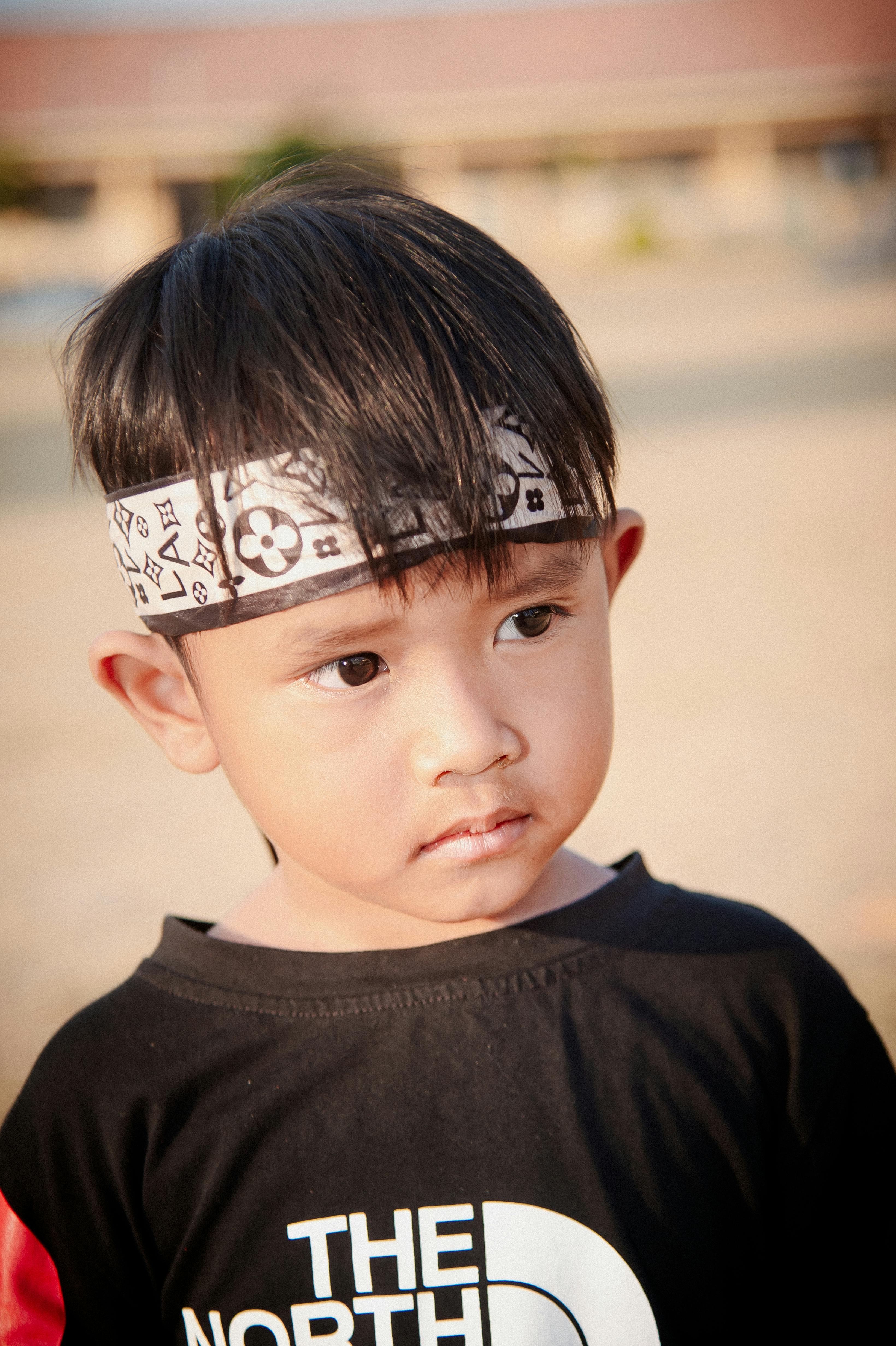 A Smiling Little Boy Sitting inside a Car · Free Stock Photo