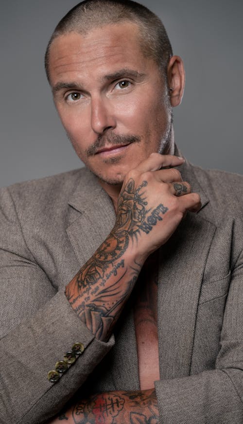 Free Portrait of a Good-Looking Man with Tattoos on His Arms Stock Photo