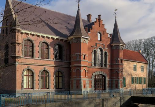 Captured scene of the gothic revival facade at a historic Dutch castle landmark.