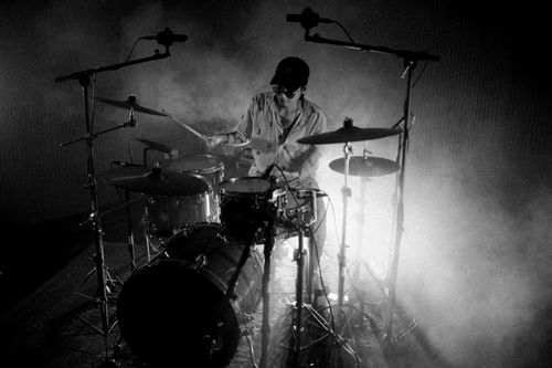 Free Captivating black and white photo of a drummer performing in a smoky jazz session. Stock Photo