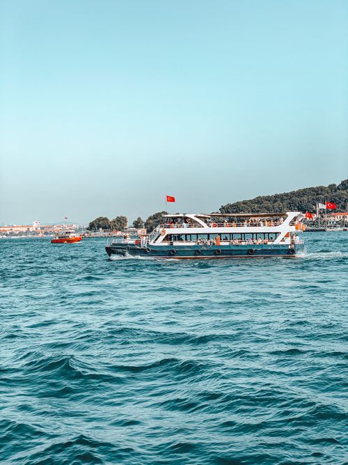 Free Scenic ferry ride on the Bosphorus Strait in Istanbul, Türkiye, showcasing vibrant blue waters. Stock Photo