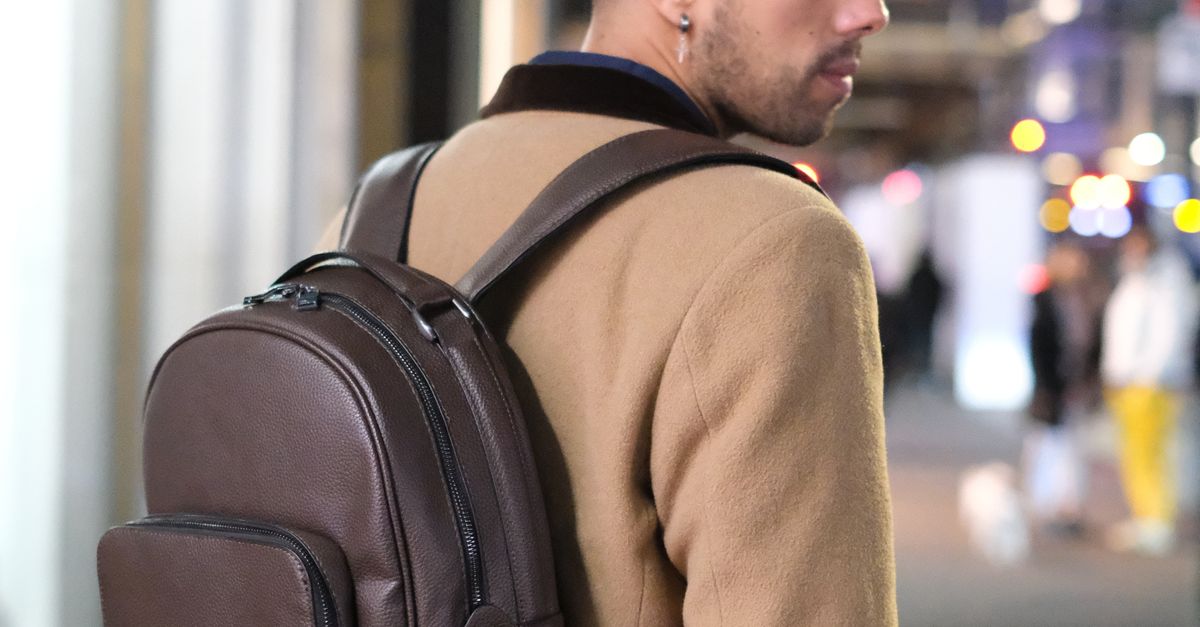 A Man Wearing Brown Backpack · Free Stock Photo