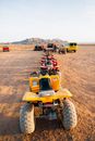 Yellow and Black Atv on Brown Sand
