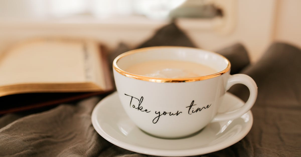 White coffee cup and open book create a tranquil, cozy atmosphere.