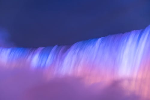 Illuminated Waterfall at Dusk 