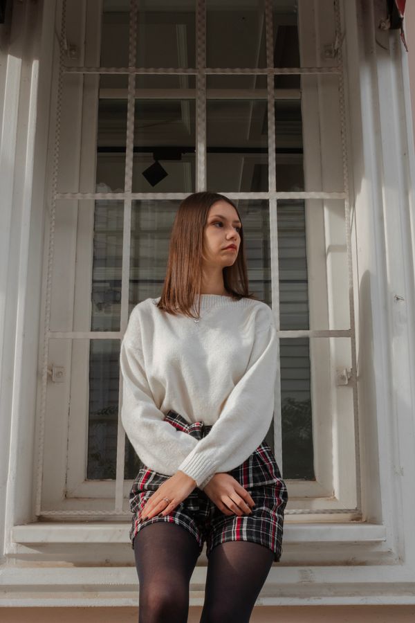Cream cashmere sweater with plaid skirt