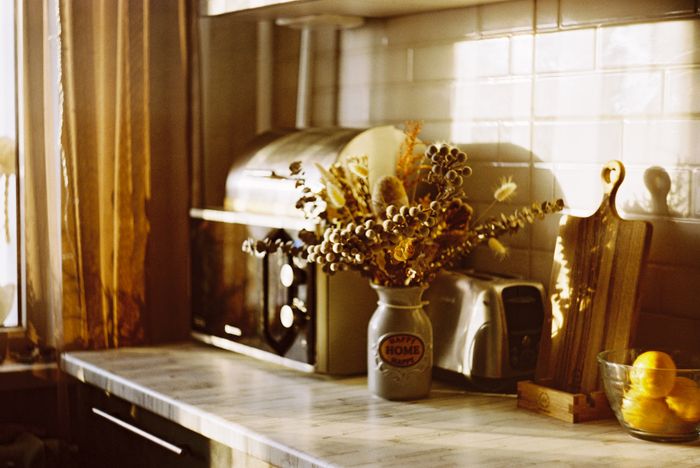 Sunlit kitchen corner with a toaster — photo by analogue enjoyer on Pexels