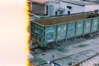 Brown and Green Train on Rail Tracks