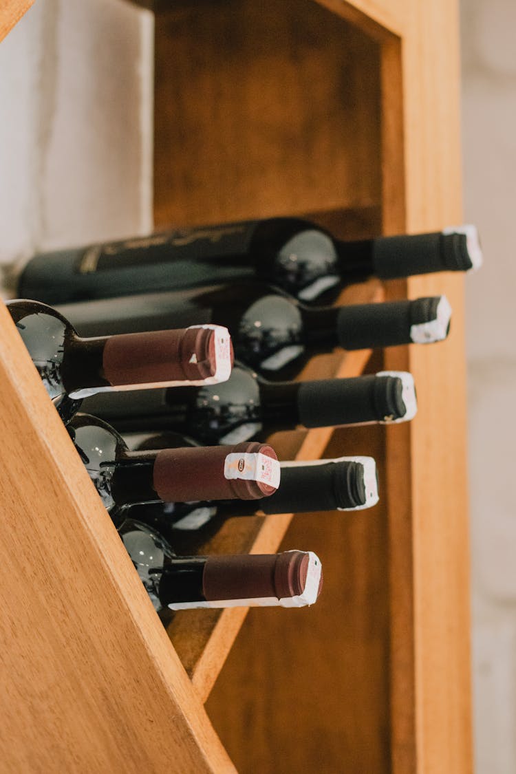 Bottles Of Wine Stacked On Shelf