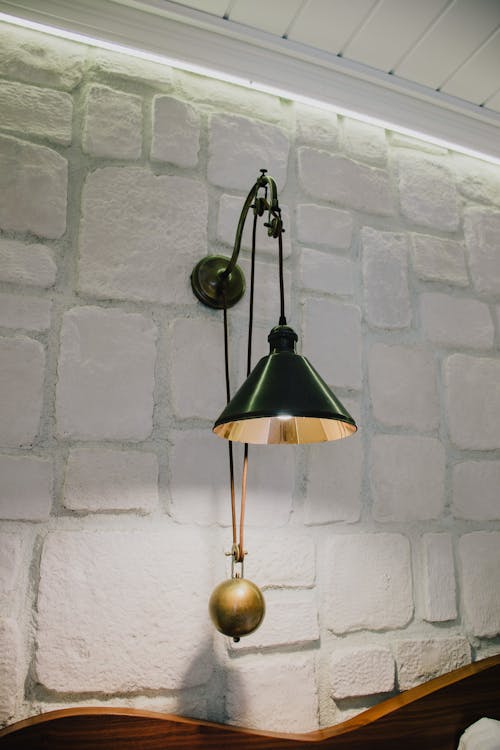 Free Black Pendant Lamp Hanging on White Concrete Wall Stock Photo