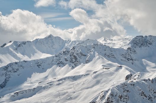 Snow Covered Mountain Under White Clouds