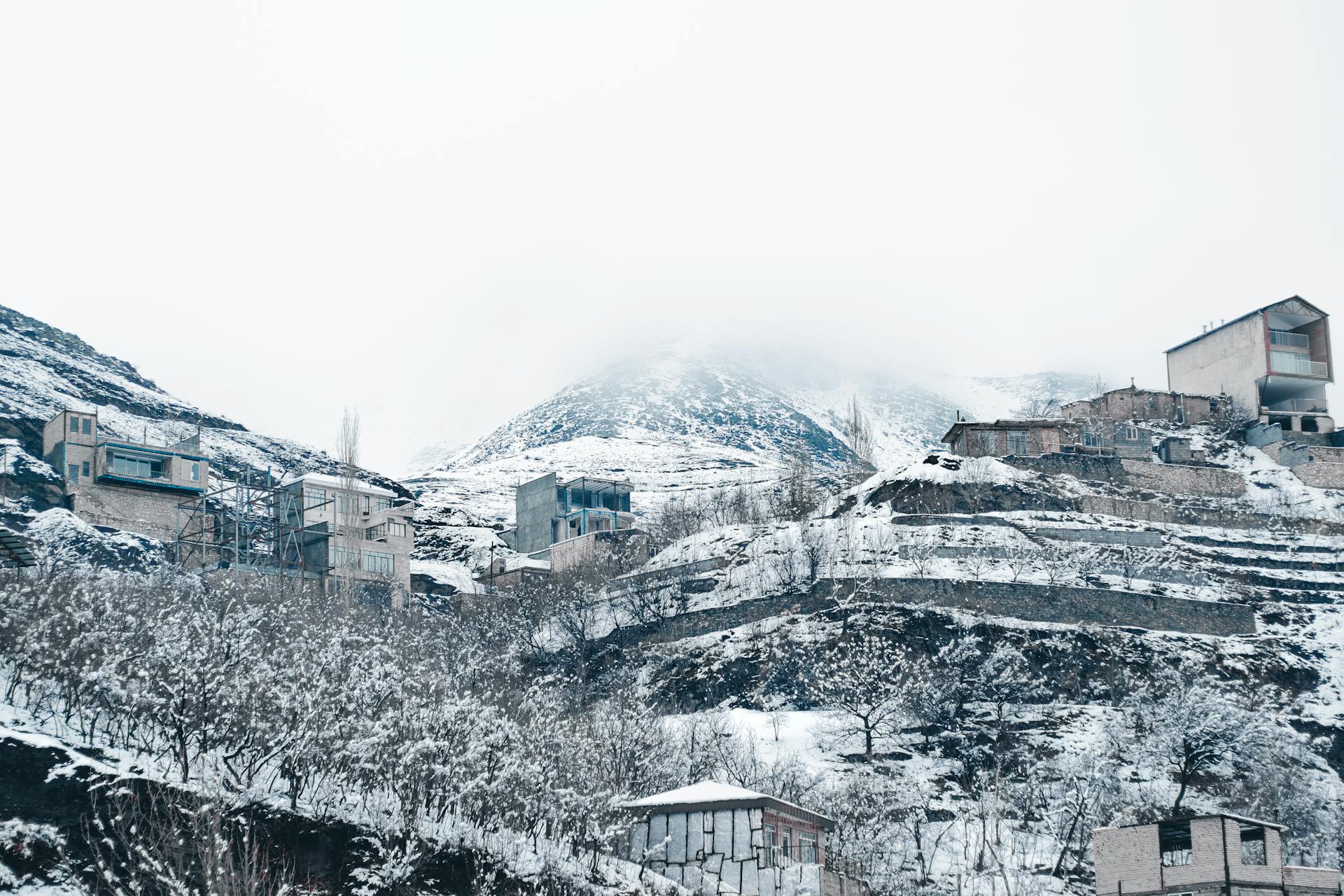 Snow Covered Houses on a Hill