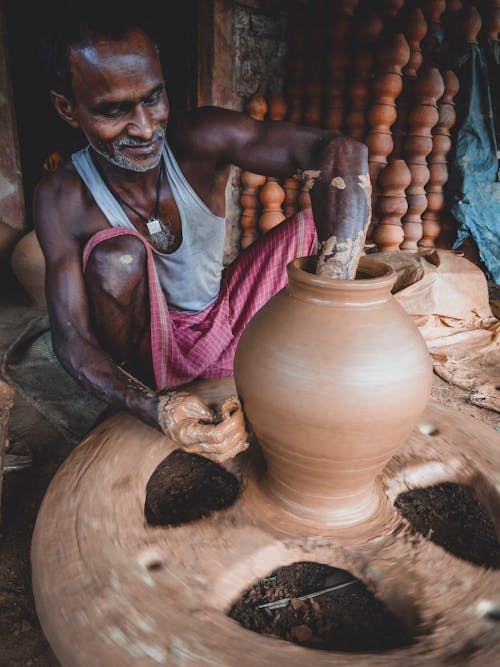 Free Man Making Clay Pot Stock Photo