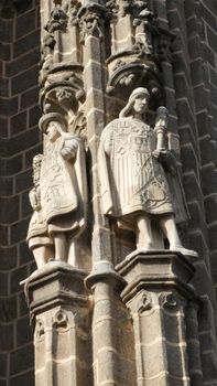 Detailed view of Gothic sculptures on the facade of San Juan de los Reyes, Toledo.