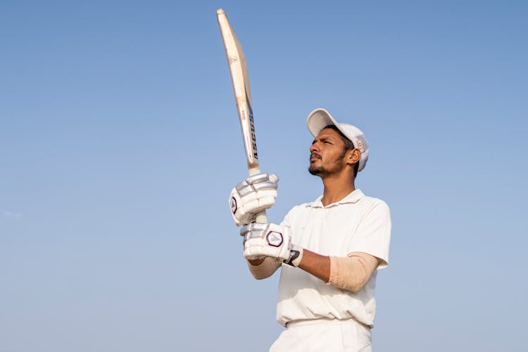 A Man Holding A Cricket Bat