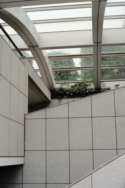 Free Modern architectural interior featuring skylight and geometric design elements. Stock Photo