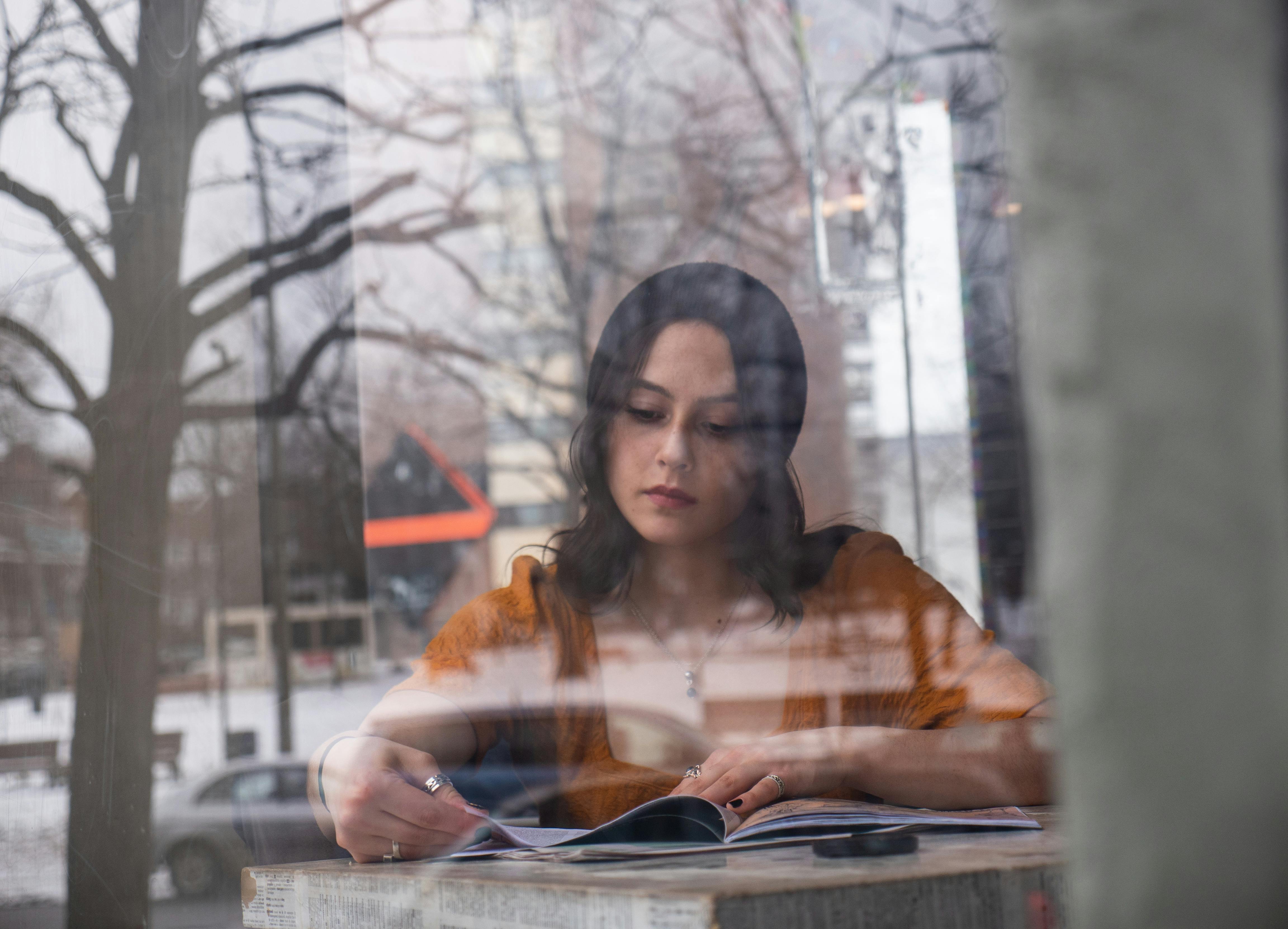 Woman Wearing White Bathrobe Sitting While Reading a Book · Free Stock ...